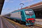 Locomotive E 464.557 was parked in a waiting position with its train on a siding at the station Verona Porta Nuova. May 9th, 2025