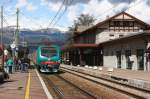 Regional train enters the station of Bressanone / Brixen with the Alps in the background