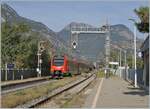 A red FS regional train and the station is not called  Ponte di San Martino  but  Pont S.