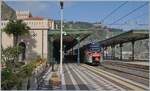 The FS Trenitalia ETR 104 094 is operating as R 12977 from Messina to Catania Airport and was photographed during the stop at the beautiful station of Taormina Giardini.