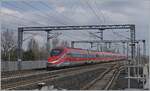 The FS Trenitalia ETR 400 052 lives up to its name and travels incredibly quickly through the Reggio Emilia AV train station heading south.