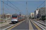 The FS Trenitalia ETR 485 037 is the Frecciargento 8306 on the way from Lecce to Roma in Trani (non stop here) 22.04.2023