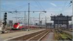 An ETR 500 (Frecciarossa) is arriving at Milan Central Station.