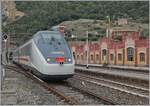 The FS Trenitalia IC 631 on the journey from Ventimiglia to Milano leaves the single-lane, 1136 meter long  Galleria Caprazoppa  and reaches its next stop, Finale Ligure.