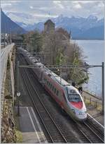 A FS Trenitalia ETR 610 on the way to Geneva by the Castle of Chillon.