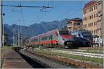 The FS Trenitalia ETR 610 004 on the way from Geneva to Milan is leaving Domodossola.