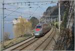 The FS Trenitalia ETR 610 004 on the way from Milano to Geneva by the Castle of Chillon.