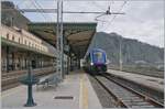 In Taormina Giradini, an HTR 412  Blues  (Hitachi Masaccio) is waiting on track 3 for the return trip to Catania.