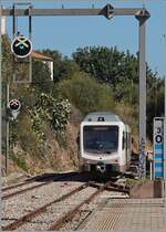 The ARST (regional transport of Sardinia) ADeS01 (95 83 4600 001-0 [A] / 95 83 4600 101-8 [B]) double railcar departs Alghero as AT 70 to Sàssari.