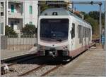 The ARST (regional transport of Sardinia) ADeS01 (95 83 4600 001-0 [A] / 95 83 4600 101-8 [B]) double railcar departs Alghero as AT 70 to Sàssari.
