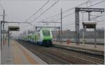 The Trenord ETR 421 031  Rock  from Porto Ceresio to Milano Porta Garibaldi is arriving at the Rho Fiera Milano Station.
