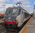Locomotive E401 020 pushes its intercity train after a short stop at the station in Ferrara.