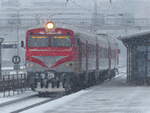 A DR1AM train is standing at the completely snow-covered Vilnius station on 1.1.2019. The train is about to depart on its journey to Turmantas, approximately 160 kilometers away.