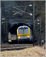3015 is hauling the IR 112 Luxembourg City - Liers out of the tunnel Kirchberg in Kautenbach on March 9th, 2012.