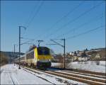 . 3009 is hauling the IR 117 Liers - Luxembourg City through Wilwerwiltz on March 13th, 2013.