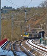 . The IR 117 Liers - Luxembourg City is leaving the tunnel Kircherg, just before entering into the station of Kautenbach on March 25th, 2013.