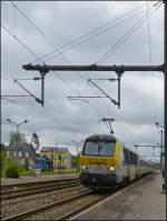 . 3012 is hauling the IR 112 Liers - Luxembourg City into the station of Gouvy on May 10th, 2012.