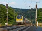 . The IR 120 Luxembourg City - Liers is running between Lelligen and Wilwerwiltz in the evening of July 25th, 2013.