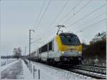 3015 is hauling the IR 115 Liers - Luxembourg City between Mersch and Lintgen on December 5th, 2010.