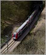 The RB 3240 Wiltz - Luxembourg City is leaving the tunnel Schankewehr between Kautenbach and Goebelsmühle on April 16th, 2012.