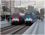 Red and blue trains pictured in Luxembourg City on December 11th, 2007.