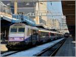 The Sybic BB 26163 in  en voyage  design pictured in front of the IC 91  Vauban  in Luxembourg City on February 1st, 2012.