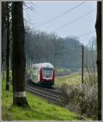 The IR 3735 Troisvierges - Luxembourg City is running trough the Alzette valley between Colmar-Berg and Cruchten on April 6th, 2008.