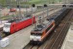 LOCON 9906 hauls a refuse train through Breda on 4 April 2014.