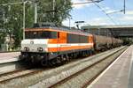 LOCON 9906 hauls an oil train through Rotterdam Centraal on 14 May 2015.