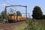 Engineering train with Strukton 303007 speeds through HUlten on 23 August 2023 toward Roosendaal.