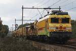On a grey 22 October 2026 Strukton 1740 'JANNIE'  hauls a railway engineering train through Alverna towards Nijmegen and Arnhem.