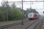 Synthus 43 advertises for the soccer club FC Twente, while passing through Wijchen on a grey 18 October 2013.