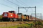 Coal train triple headedby 6400s (of which 6498 in front) passes through Wijchen on 17 June 2006.