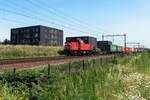 DBC 6429 hauls a container shuttle through Tilburg-Reeshof on 23 July 2021.