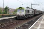 On a grey 16 August 2013, CapTrain 6601 passes through Blerick to Venlo.