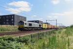 CrossRail Benelux DE 6306 hauls a container train through Tilburg-Reeshof on 23 July 2021.
