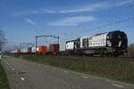 RFO 1605 hauls a container train through Boxtel on 30 March 2021.