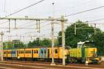 NedTrain 709 shunts a Plan V emu at Eindhoven on 13 March 2010.