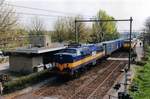 On 27 April 2003 diverted ACTS container train with 1253 at cthe reins speeds through Tilburg West.