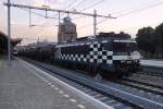 Check! HSL 1832 with tank train leaves 's Hertogenbosch on the evening of 9 August 2013.