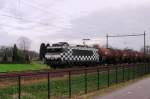 ON a grey 8 January 2014 HSL 1832 with extra tank train passes Alverna.