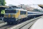 A graffiti-disgraced 1604 hauls a railway engineering train through's Hertogenbosch on 18 April 2005.
