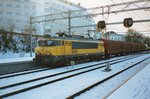 On a snowy 27 January 1998 NS 1646 hauls a steel train through Arnhem CS.