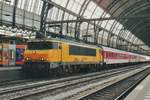 On 24 October 2009, RaiLioN 1613 'ASSEN' readies with a CNL for Wien West for departure at Amsterdam Centraal.
