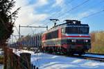 On a snowy 27 January 2017 RailLogix 1619 hauls a diverted freight through Alverna.