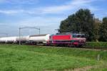 Tank train headed by RaiLogix 1618 speeds on 23 July 2019 through Hulten toward Venlo.