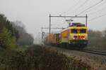 On a drizzly 5 December 2023 Strukton 1740 hauls an engineering train through Alverna.