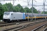Railpool 186 424, a.k.a. 2863, calls at Antwerpen-Berchem with a Beneluxtrain on 29 June 2016.