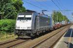 On 10 June 2017 Railpool 186 456 speeds through Tilburg-Universiteit.