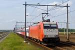 HSA 186 111 hauls a fast train through Lage zwaluwe on 26 June 2012.